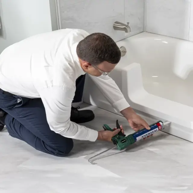 Installer Putting Adhesive